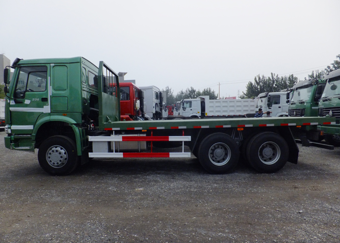 Camión de plataforma con chasis de camión de servicio pesado Howo y cerraduras giratorias para cargamentos y contenedores de 20 pies
